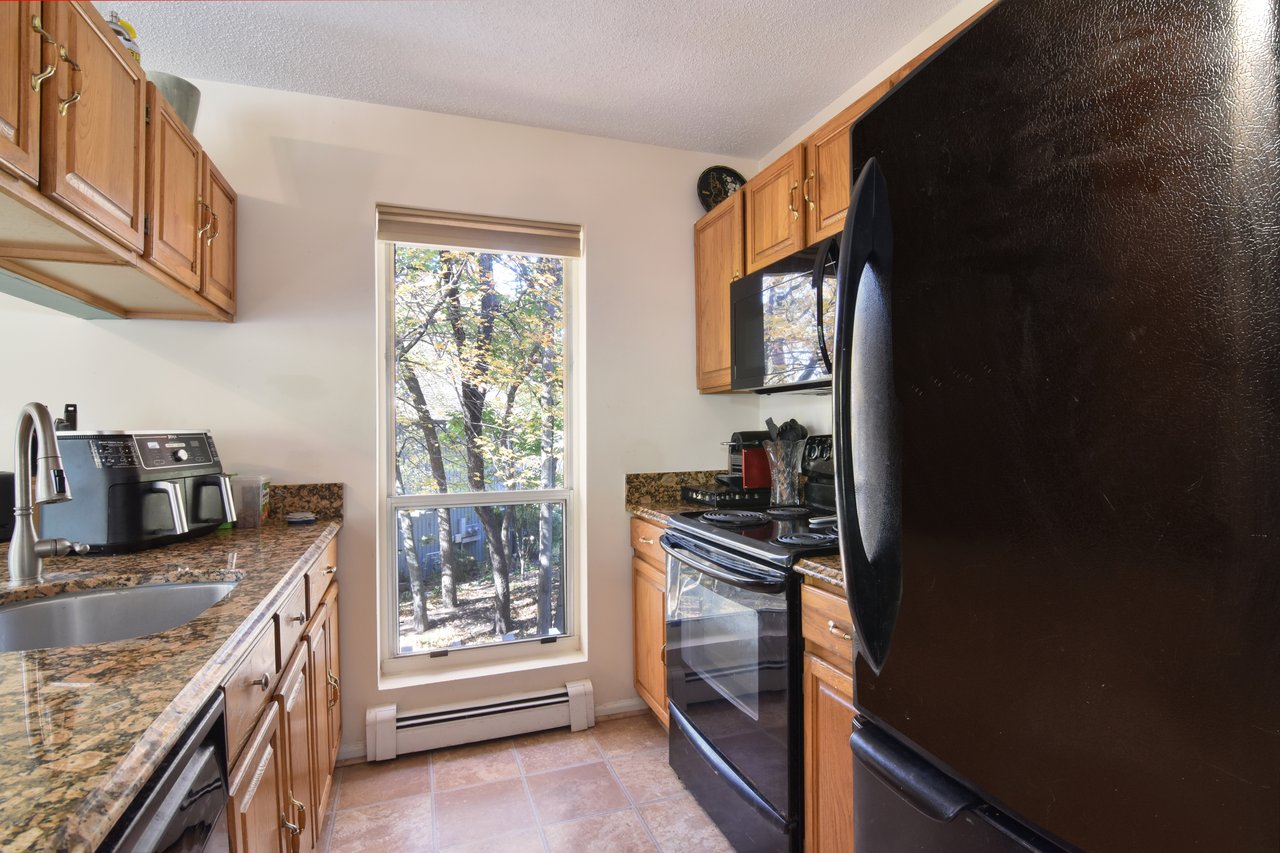 Natural light streams in through an additional floor-to-ceiling window.
