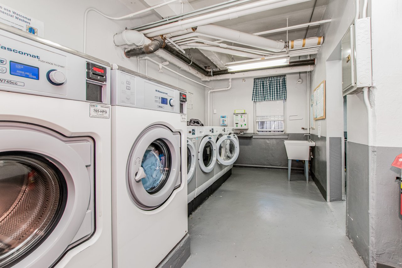 Shared laundry featuring washing machine and dryer