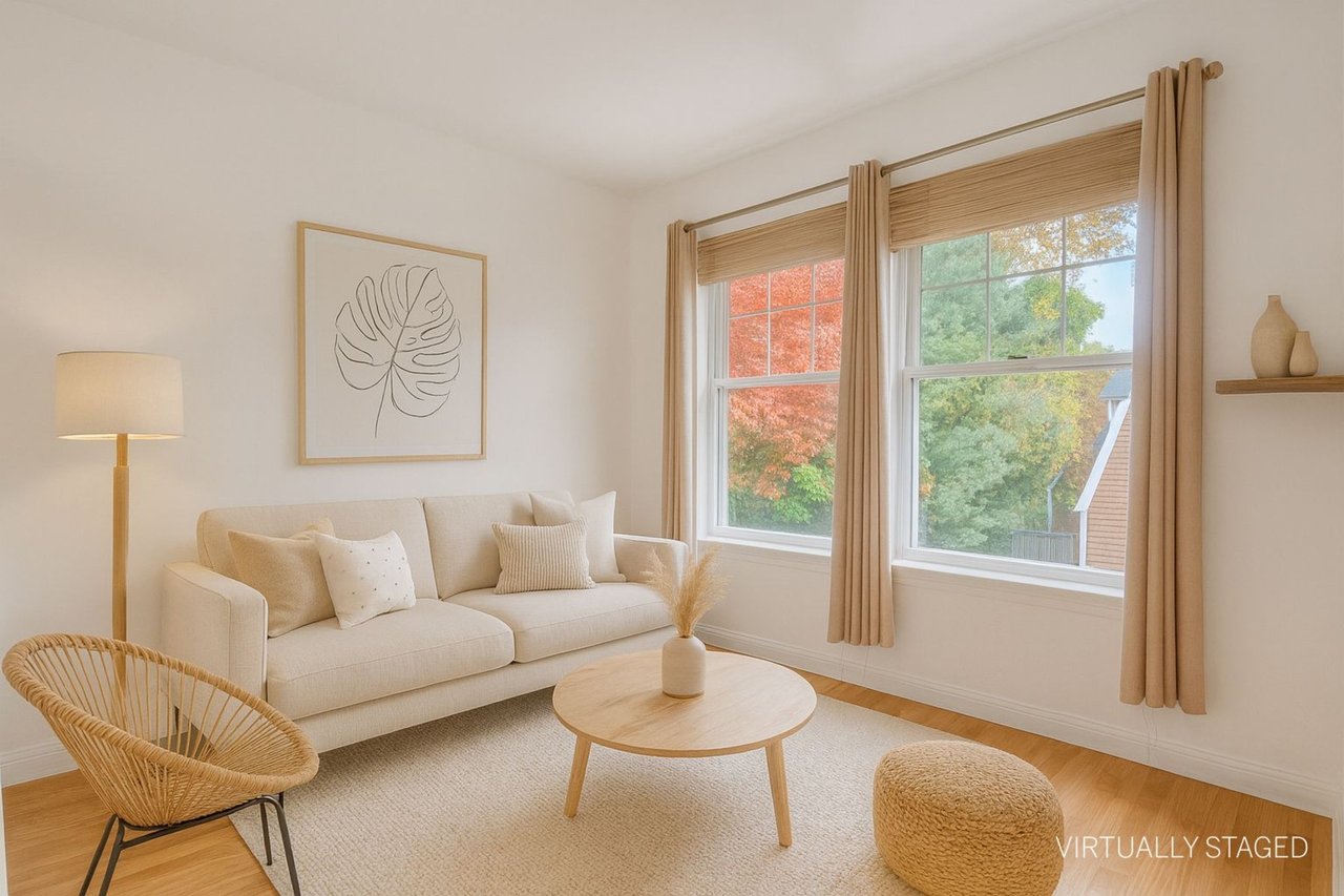 Virtually staged living room featuring light wood-type