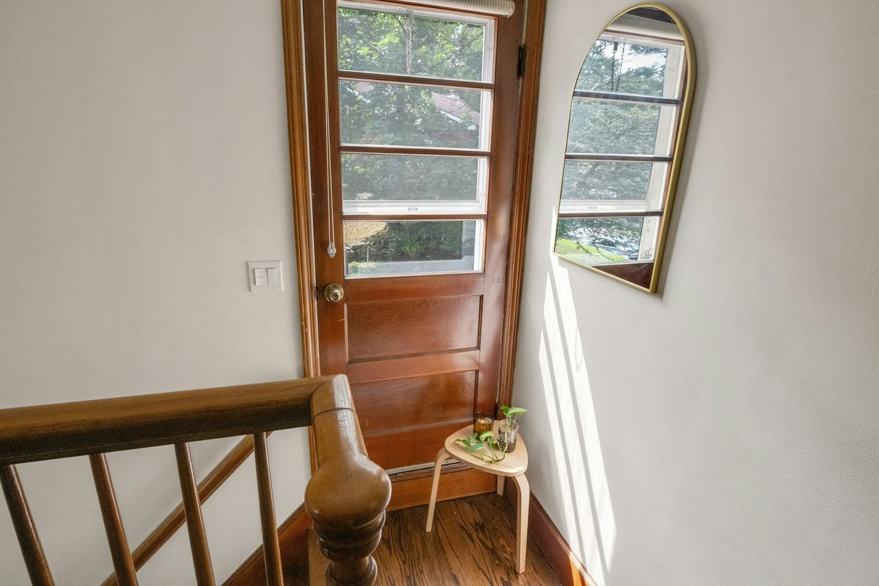 Entryway featuring wood finished floors and baseboards