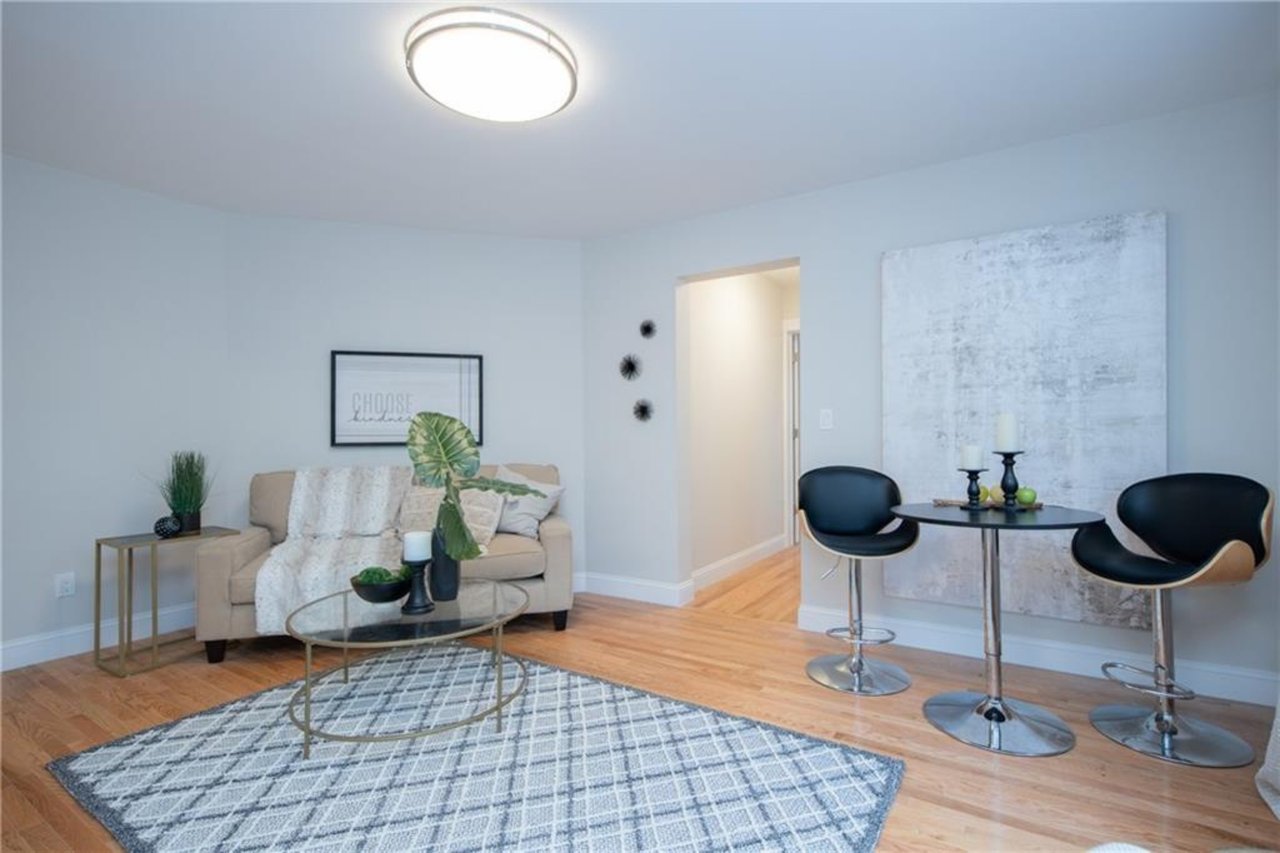 Sitting room featuring wood-type flooring
