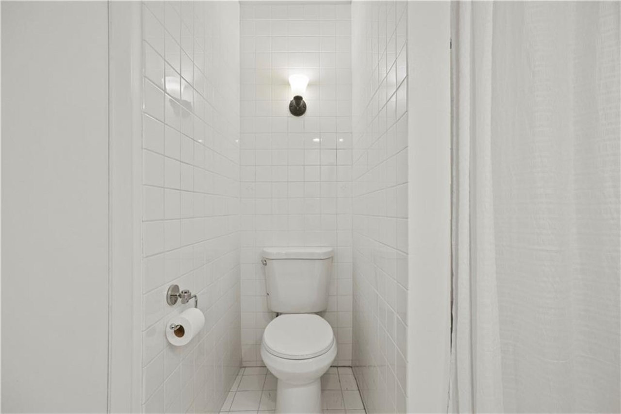 Bathroom with tile walls and tile patterned floors