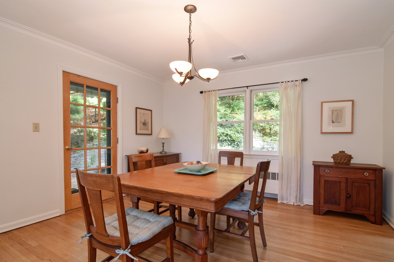 Dining room opens to the expansive slate patio