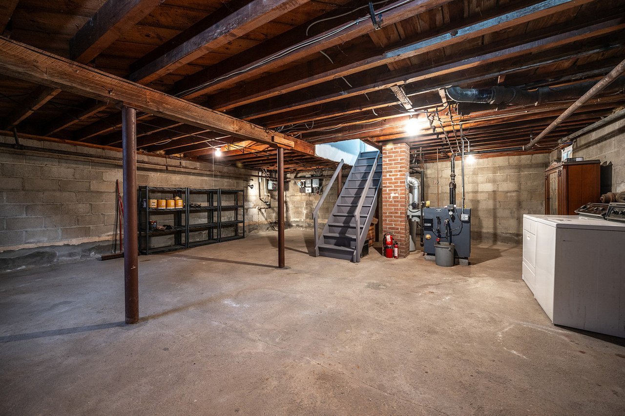 Unfinished basement - with Laundry and Ample Storage...