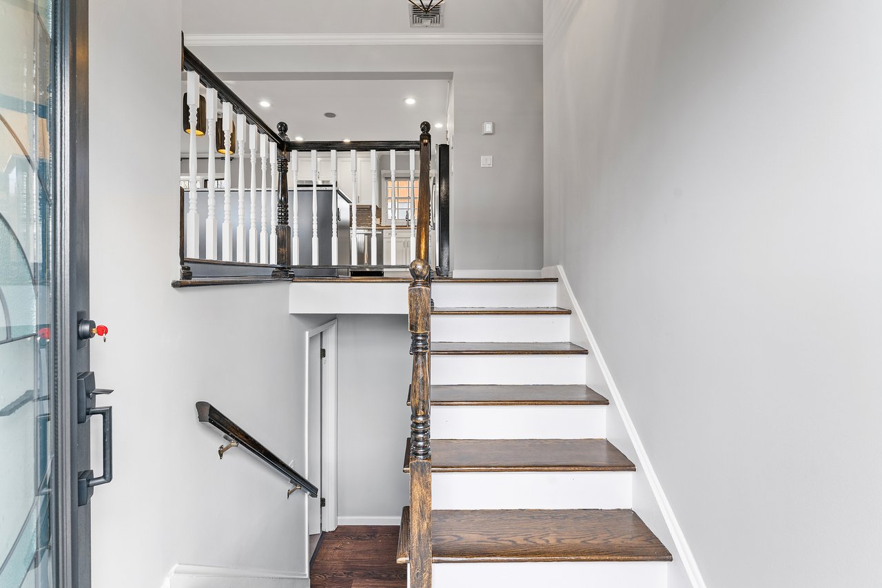 Staircase featuring recessed lighting and wood finished floors