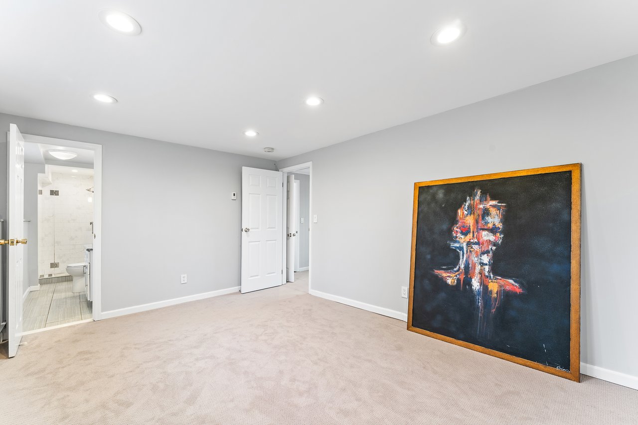 Unfurnished bedroom with recessed lighting and light carpet