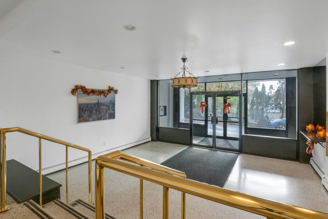 Lobby with recessed lighting and expansive windows