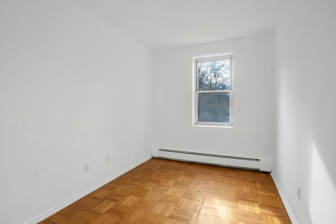 Second bedroom with hardwood floors
