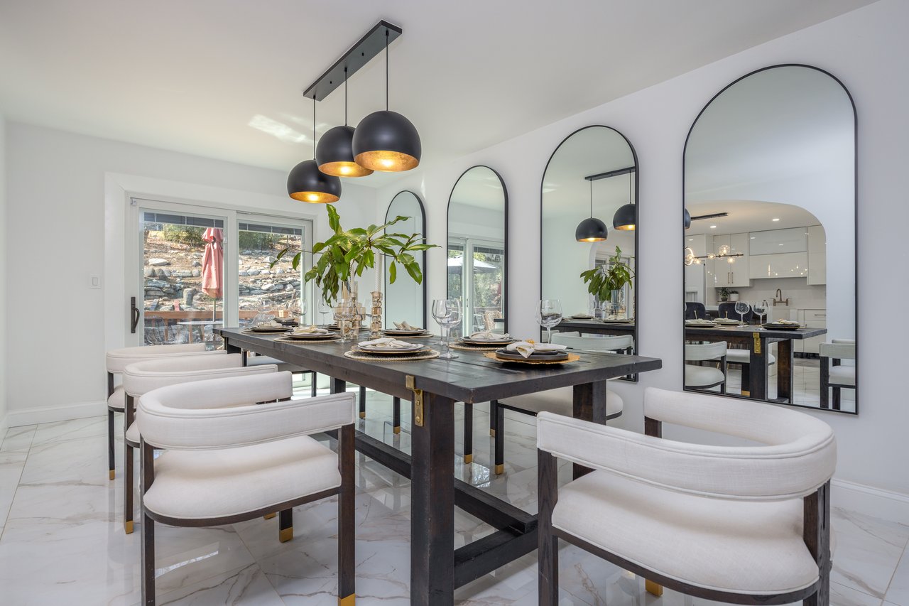 Dining area featuring light marble finish flooring and plenty of natural light