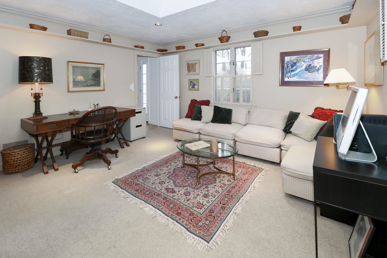 Alternate view of third bedroom which has hardwood floor under carpet, full bath, and walk-in closet.