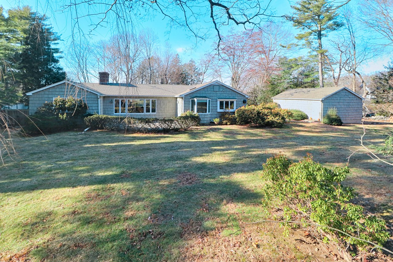 Rear grounds with stone patio.