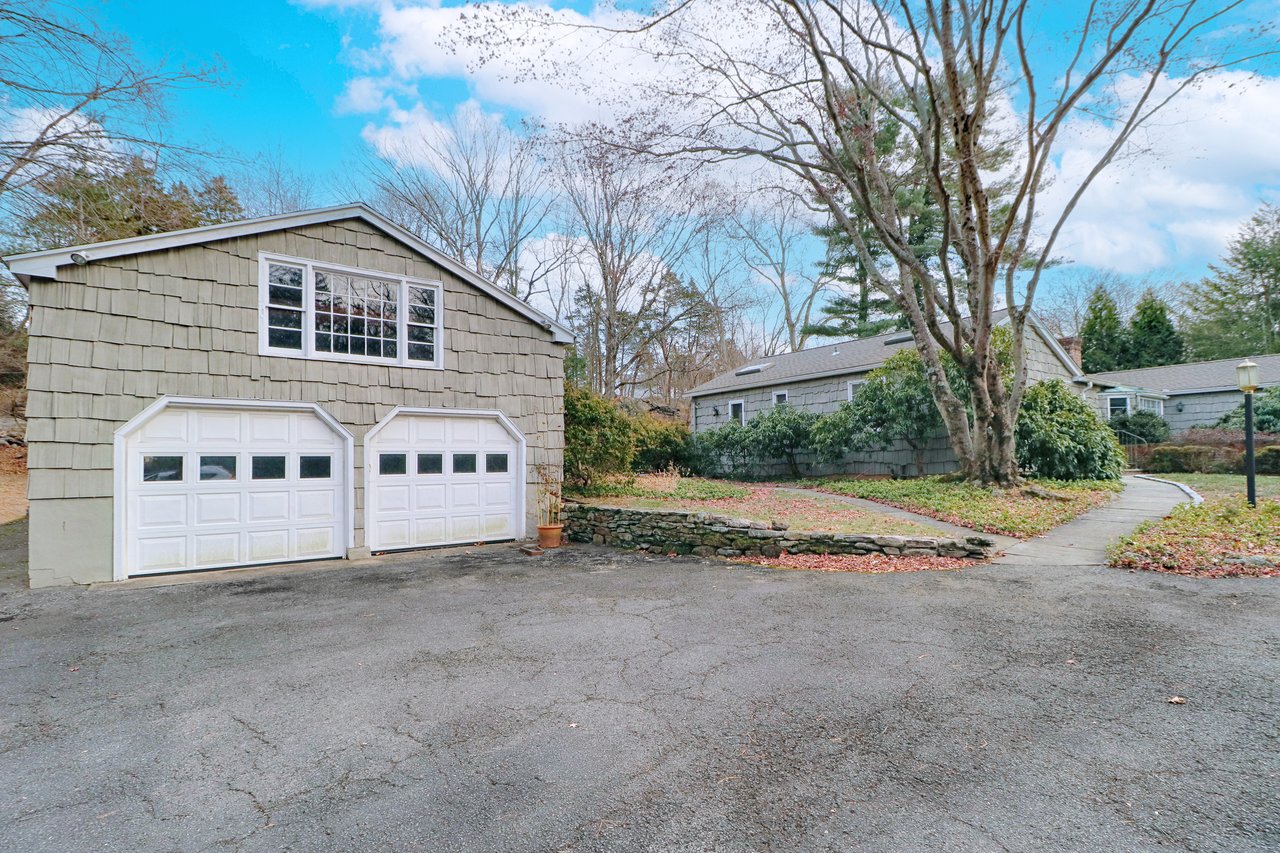 Detached two car garage with storage loft, and tons of parking offers opportunity for adding additional square footage - think art studio or he/she cave with sunlight.
