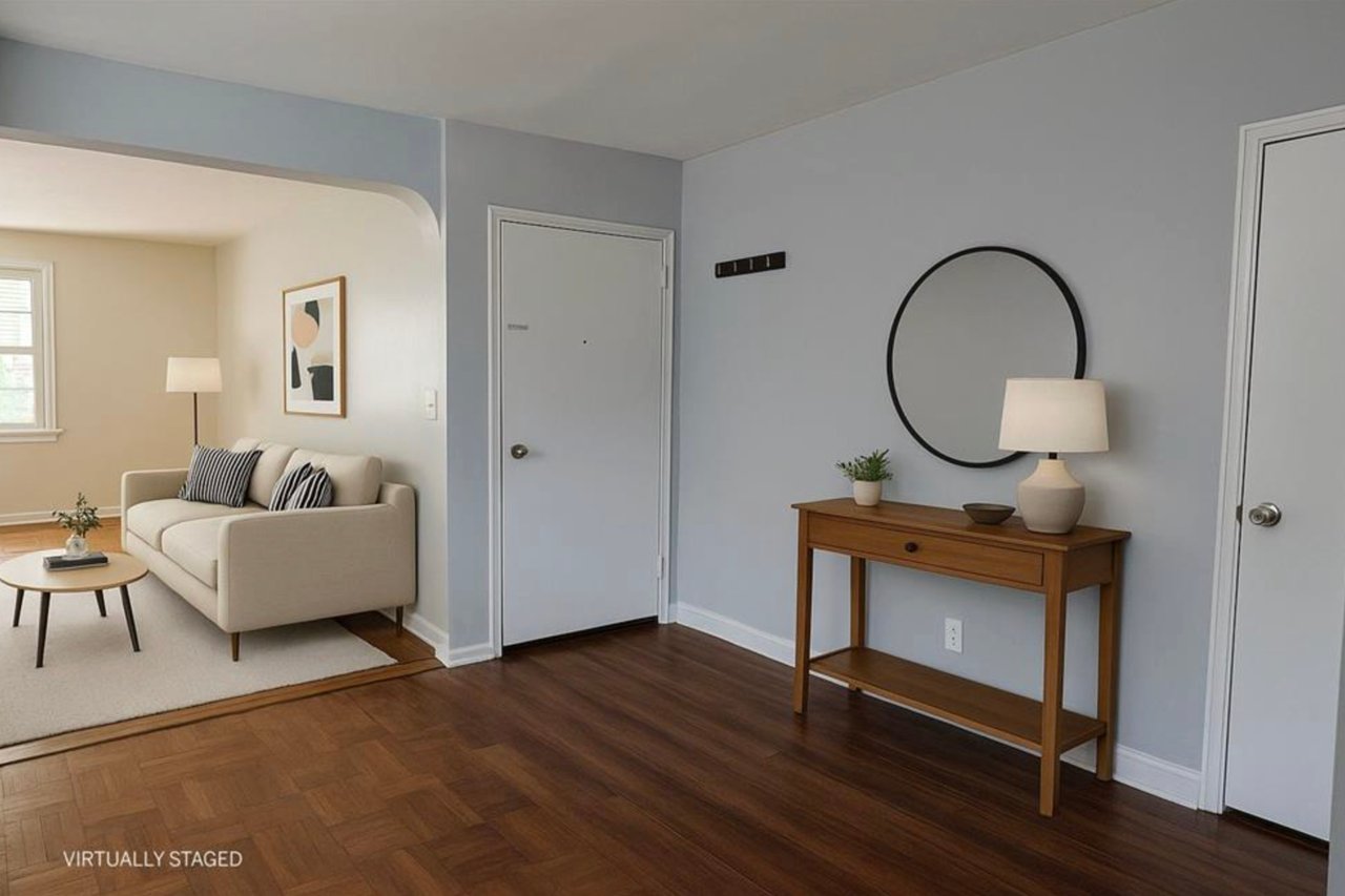 Living area featuring arched walkways and parquet flooring