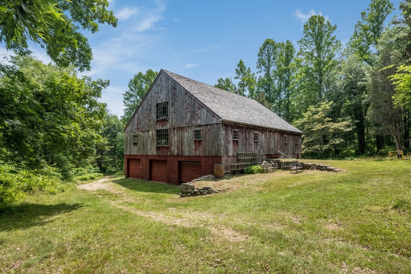 Post and beam barn with tandem space for 6+ vehicles on lower level.