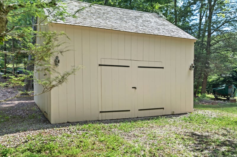 The post an beam barn added to the property after the home was moved here.