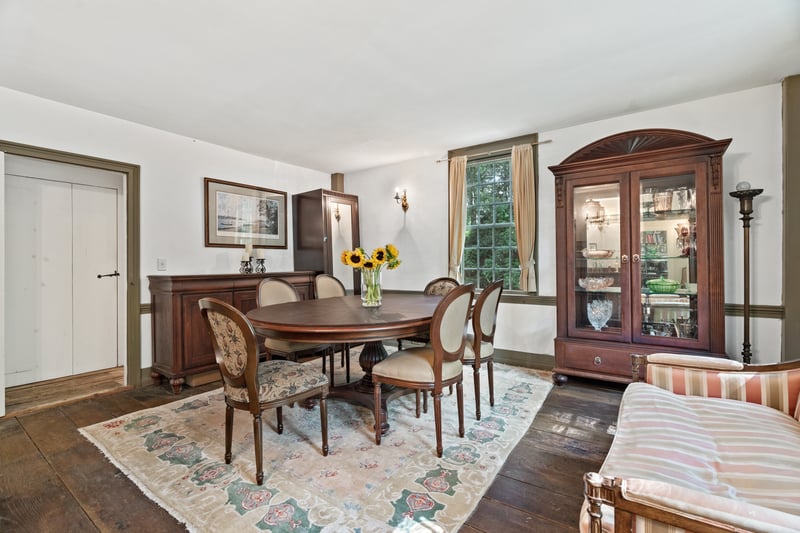 The formal dining room benefits from the sunlight streaming through the front of the house.