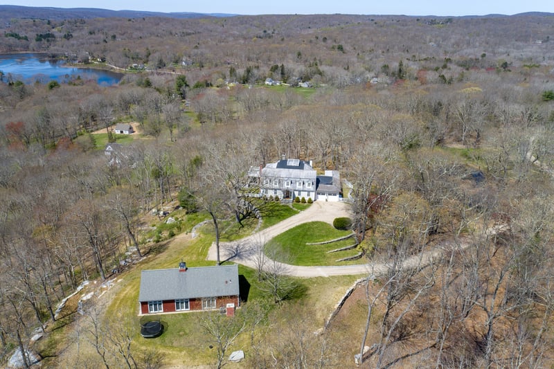 This beautiful estate includes an 1800 sqft Guest House with flex space.