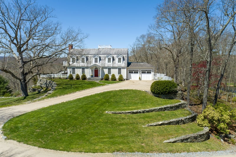 The front yard is professionally terraced on both sides to create a grand entrance.