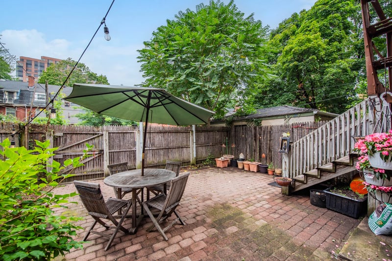 Fenced backyard with the entry to 3 car parking space