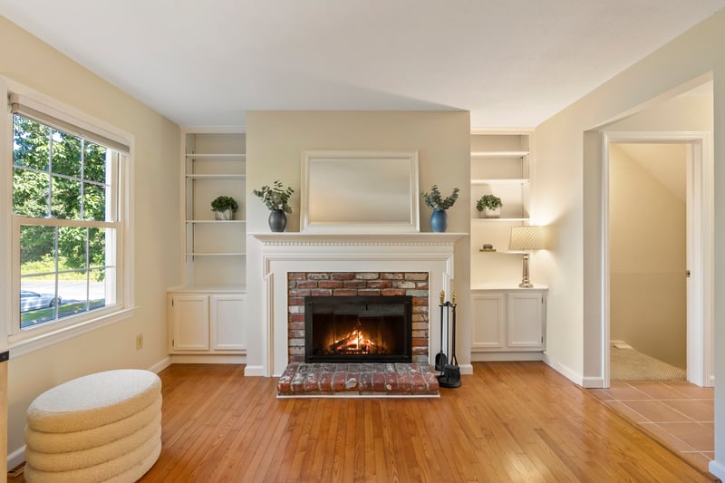 Warm and inviting fireplaced living room with beautiful built-ins