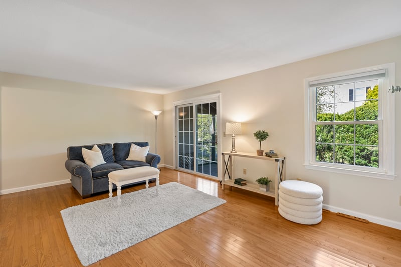 Sliders from living room lead to private screened porch
