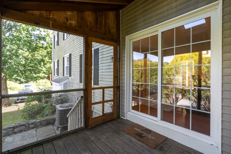 A newer set of sliders off your screened porch open to living room