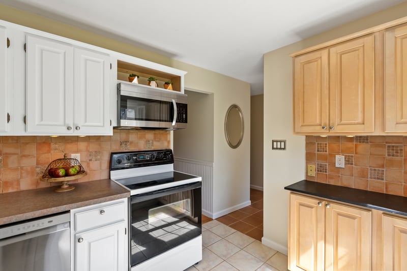 Breakfast bar w designer touch, maple cabinetry and stone countertop, the perfect coffee bar and cell phone charging station