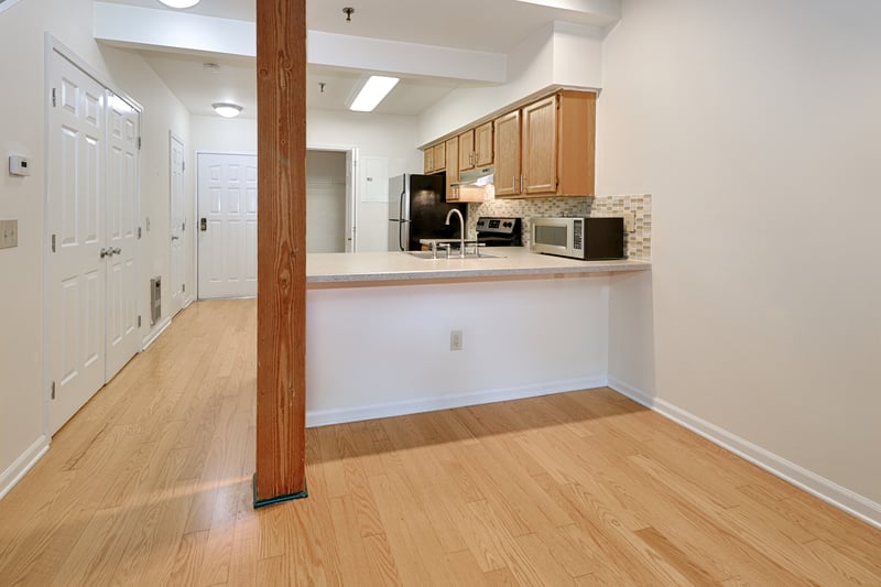 There is a large pantry in the back of the kitchen for storage. A half bath and another large closet are in the hallway across from the kitchen.