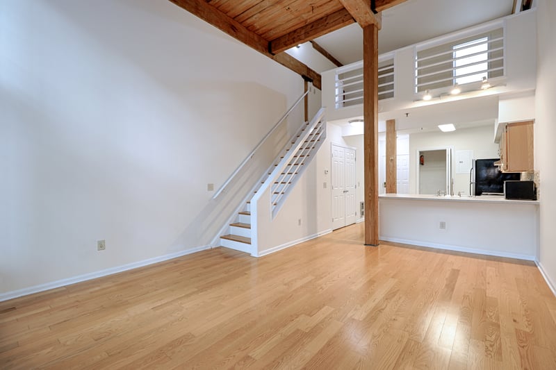 The upstairs bedroom is cozy, while having ample storage. It's open to below, as seen above.