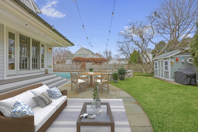 Bluestone terrace right outside kitchen! Virtually staged.