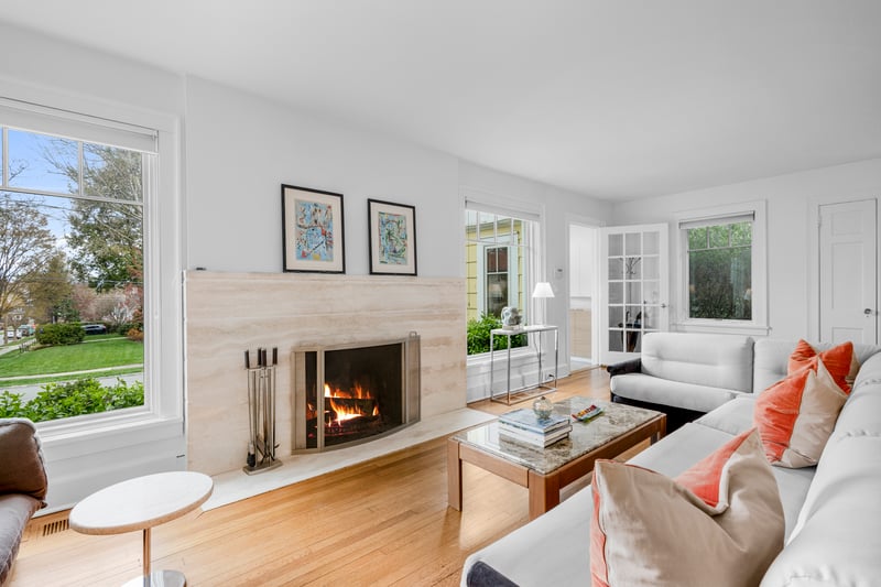 Living room with wood finished floors and a fireplace