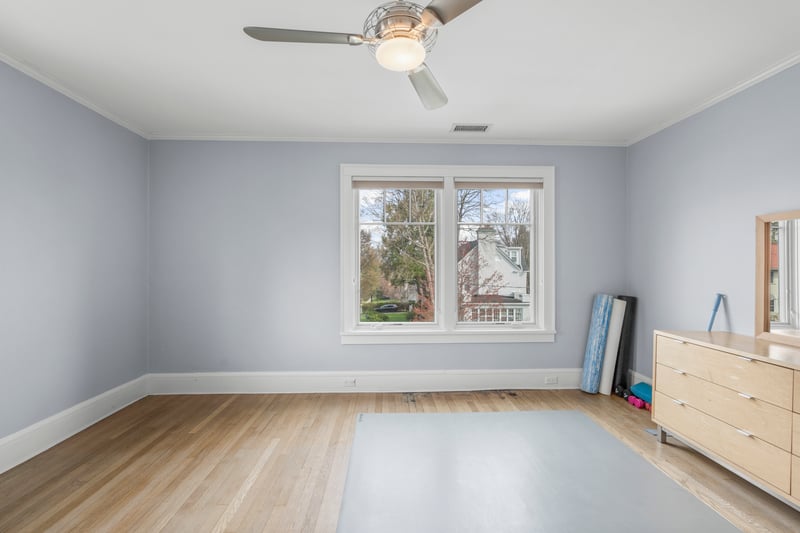 Unfurnished bedroom with baseboards, ornamental molding, light wood-style floors, and visible vents
