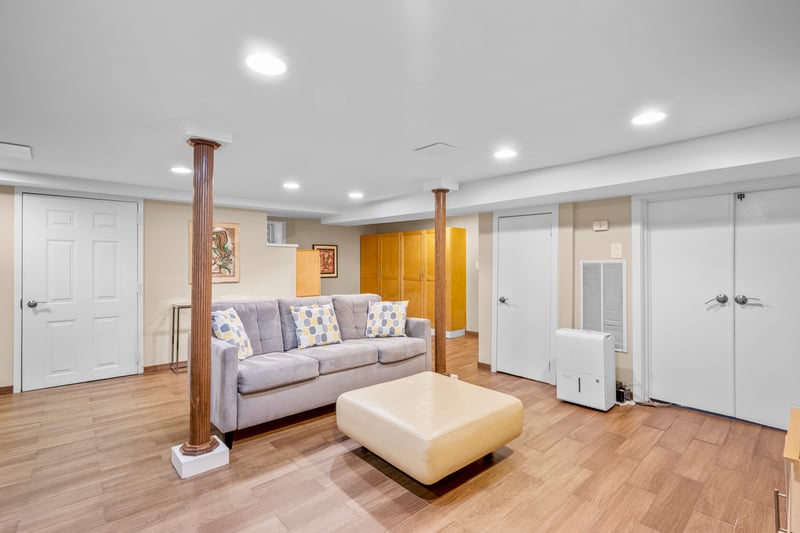 Living room featuring recessed lighting, light wood-style flooring, and visible vents