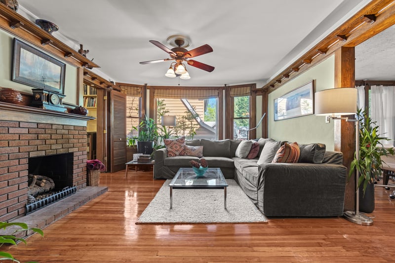 The family room has amazing bay windows overlooking the side garden and a gas fireplace