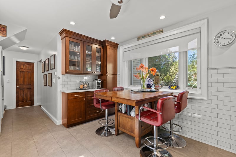 Eat-in kitchen space with another bay window