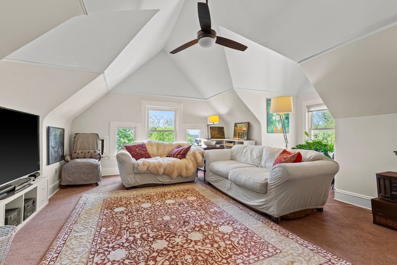 3rd floor living space with a healthy amount of sunlight, and lofted ceiling