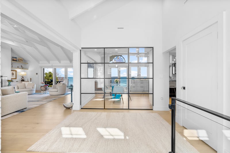 Custom Glass Wall Separating Dining Area from Foyer