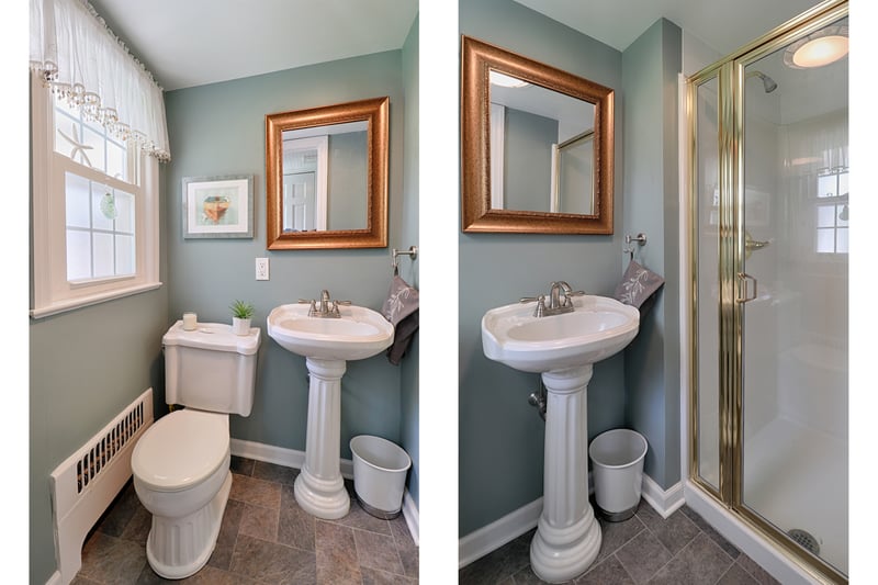 Full bath on main floor with slate floor, pedestal sink and shower.