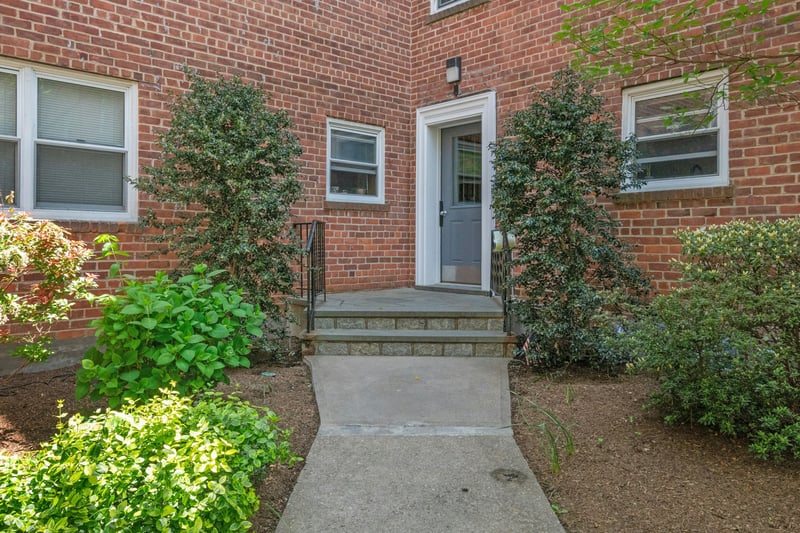 View of exterior entry with brick siding