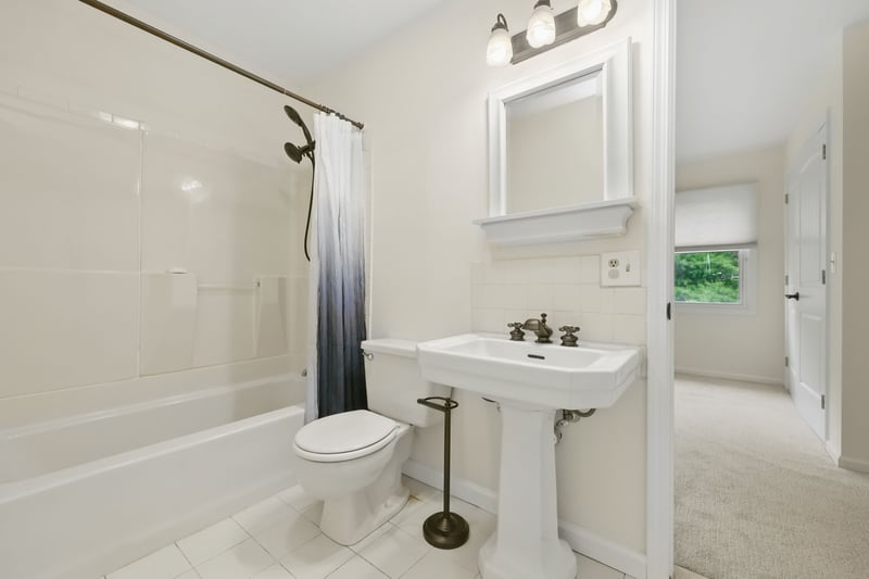 Full Bathroom with linen storage area.