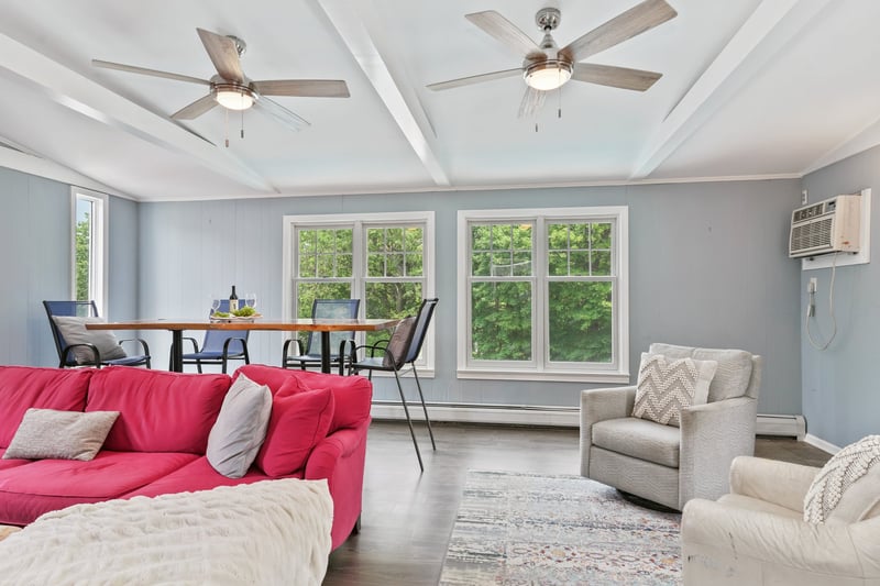 Family room with vaulted ceiling and lots of windows