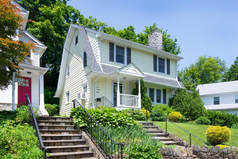 The front steps create a charming, elevated entry that adds to the home's outstanding curb appeal....