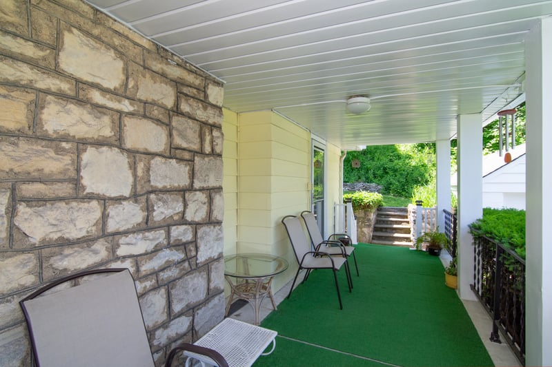 The porch offers adequate privacy as well as convenient access to the backyard....