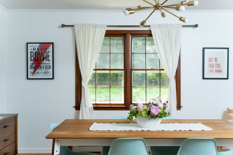 Dining room featuring a chandelier, healthy amount of natural light, and crown molding