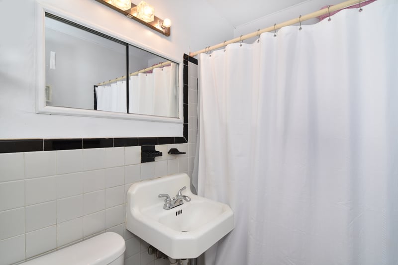 A simple full bath rounds out the first floor.