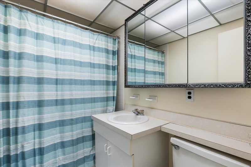 Full bathroom with vanity and curtained shower