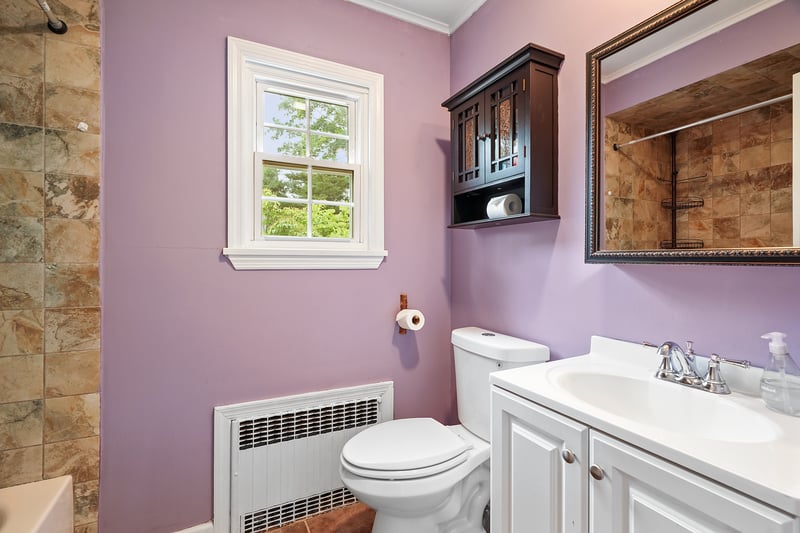 First floor bathroom with tub and shower