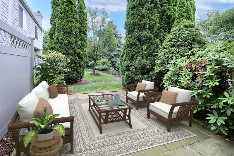 Virtually staged photo of patio. Enjoy entertaining or quietly relaxing the while enjoying the chirping birds on your private patio.
