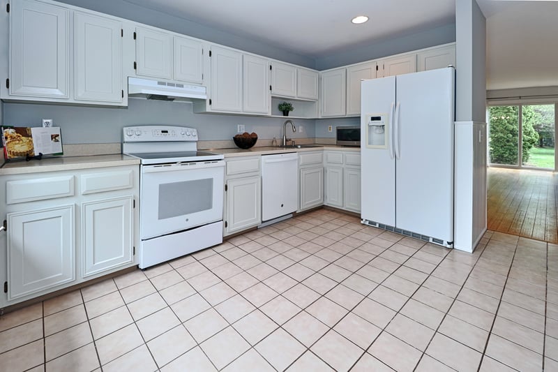 Alternate view of kitchen looking into living area.
