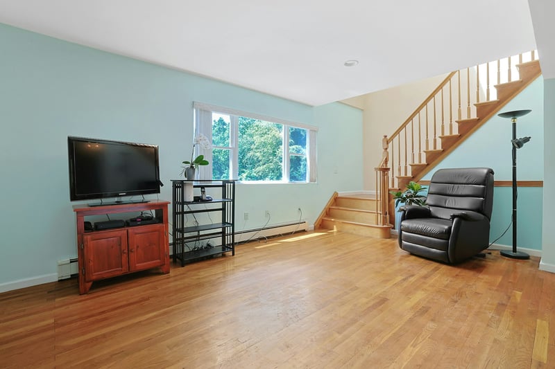 Big picture window, and skylight over stairs bring in the light.